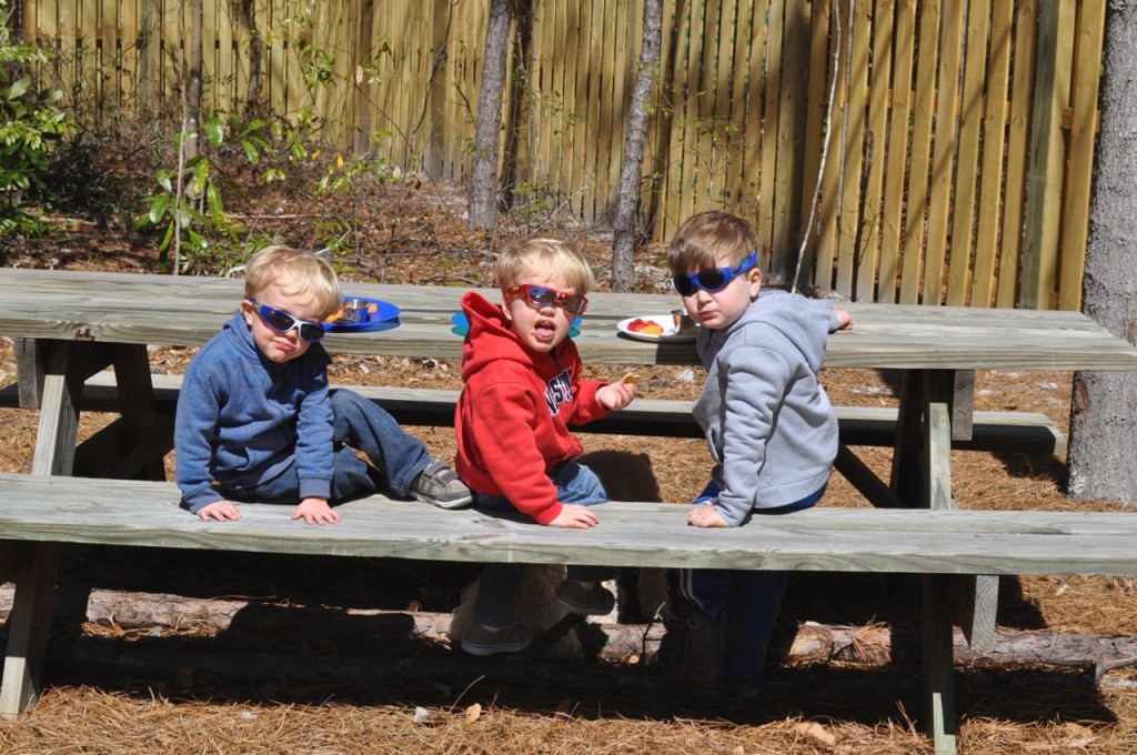 Our boys around Paw Paw's picnic table